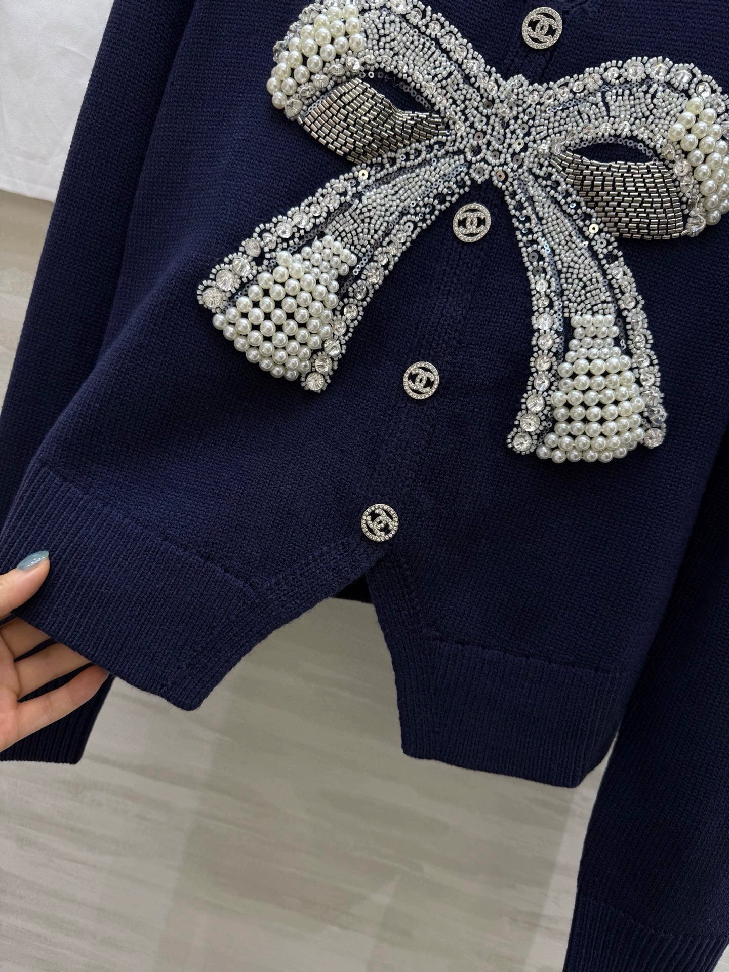 Pearl-studded bow pullover
