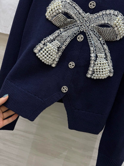 Pearl-studded bow pullover
