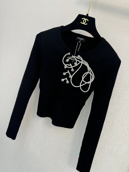 Black knitted long sleeved top