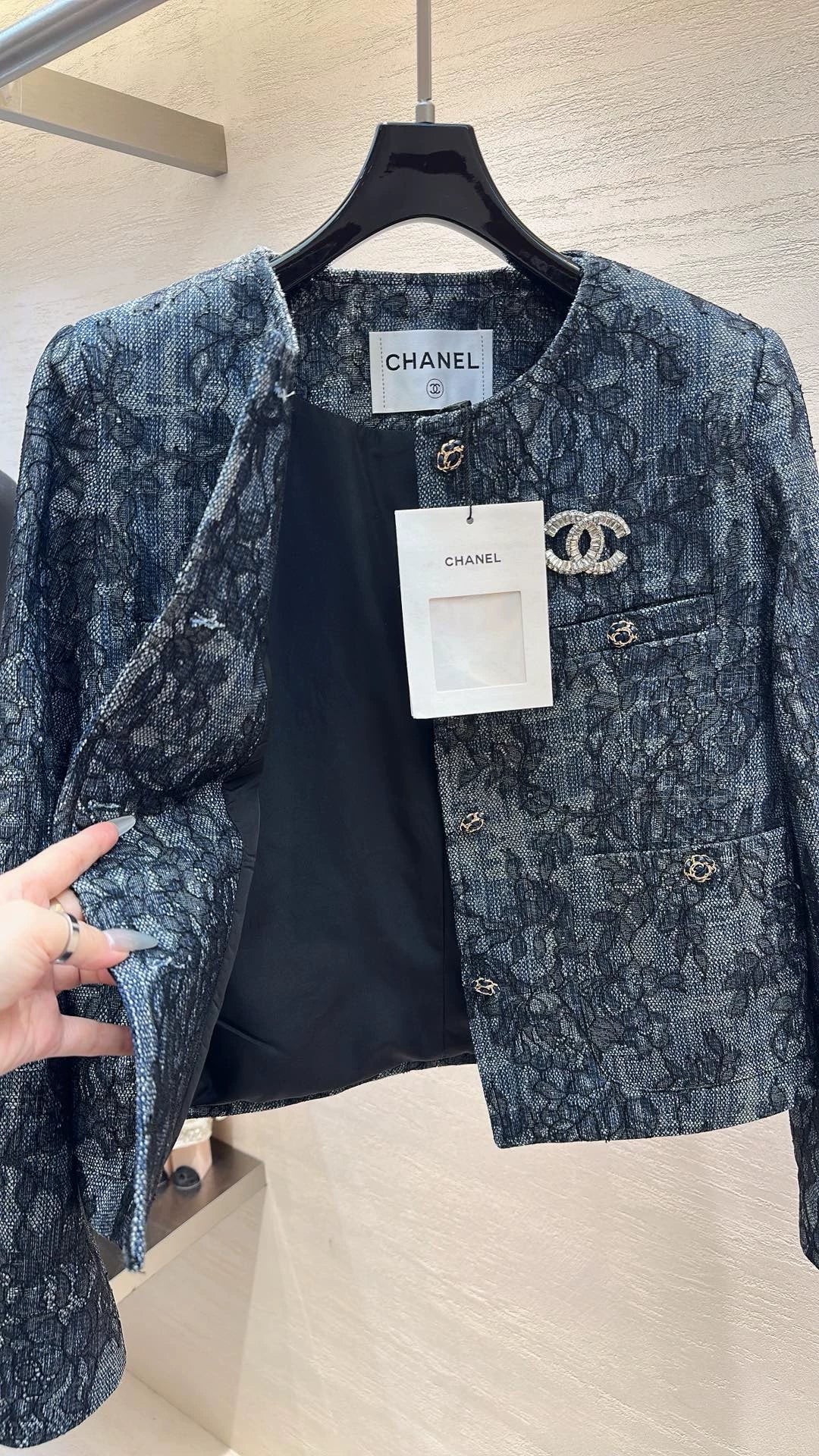 Brooch-adorned jacket