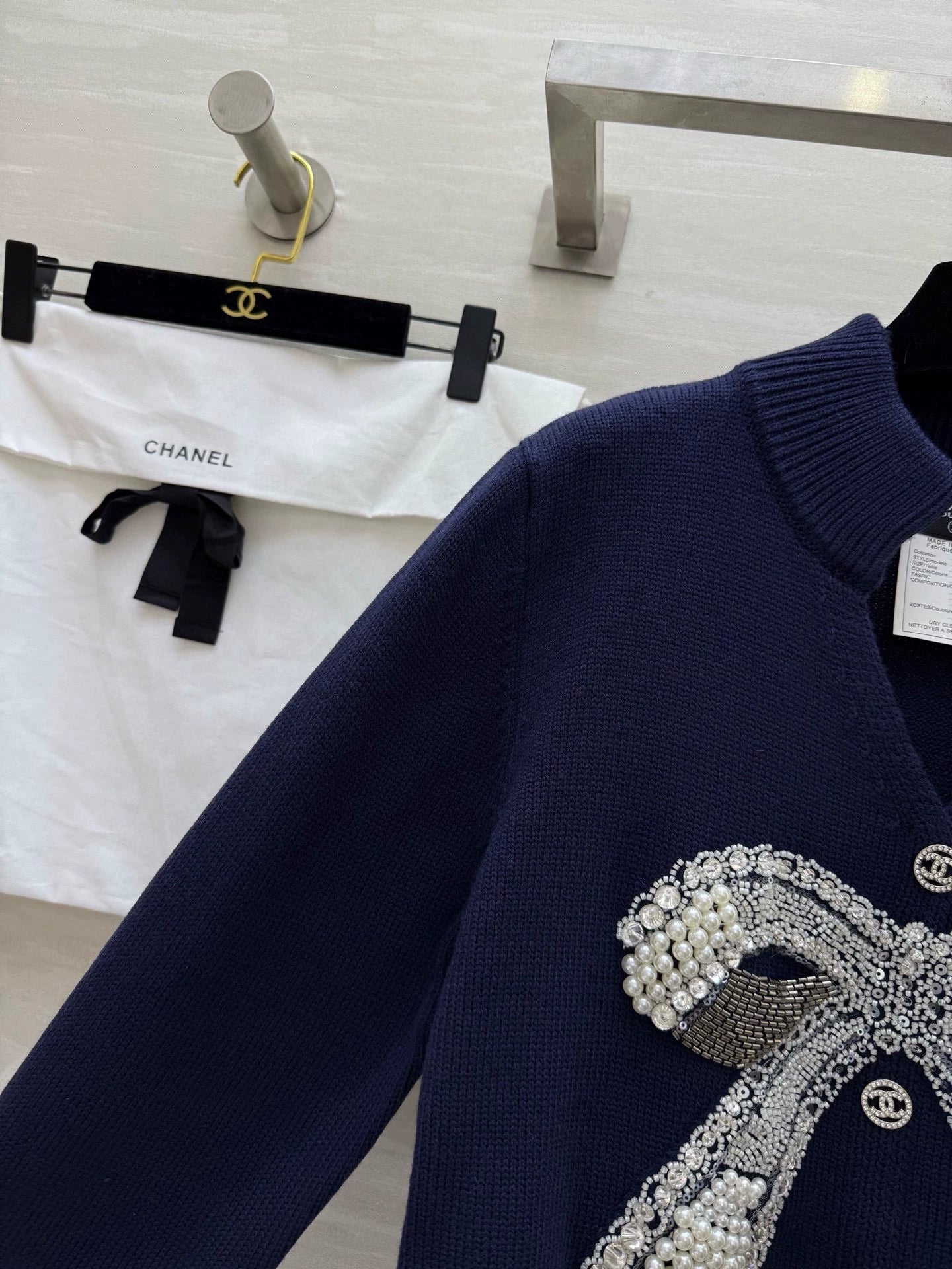 Pearl-studded bow pullover
