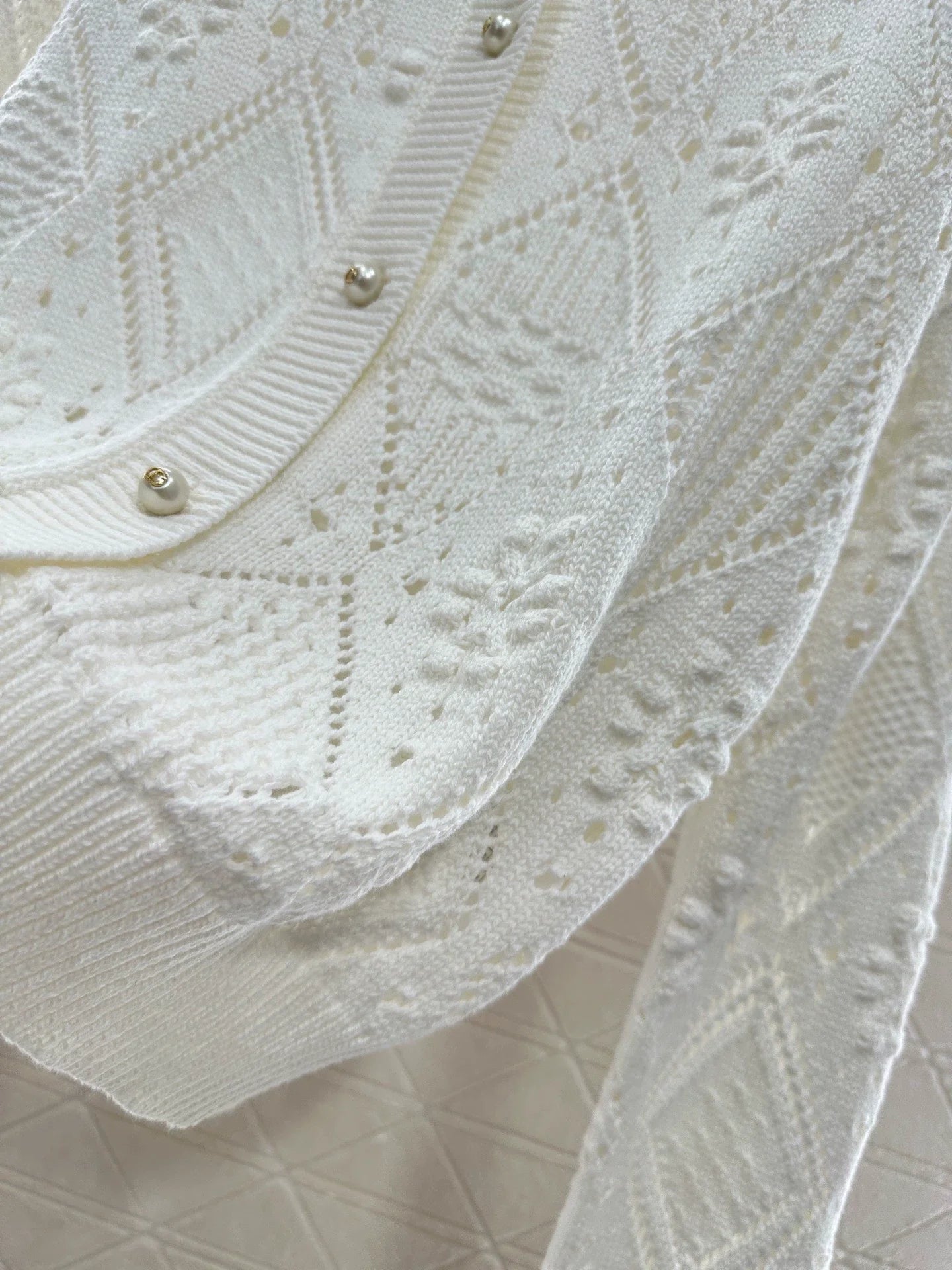 Hollow jacquard knitted cardigan