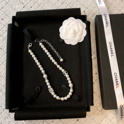 CHANEL 26S DOUBLE C LOGO PEARL NECKLACE WITH CRYSTAL DETAIL IN SILVER METAL 631884