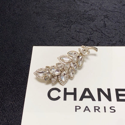 logo brooch