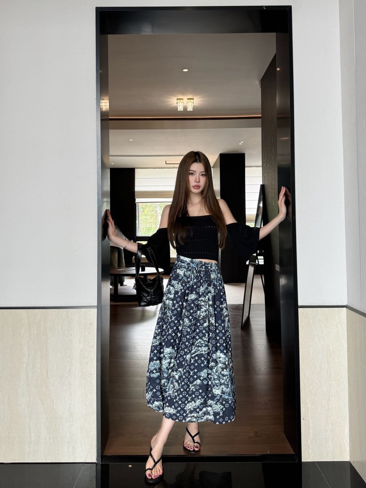 All-over monogram print midi skirt